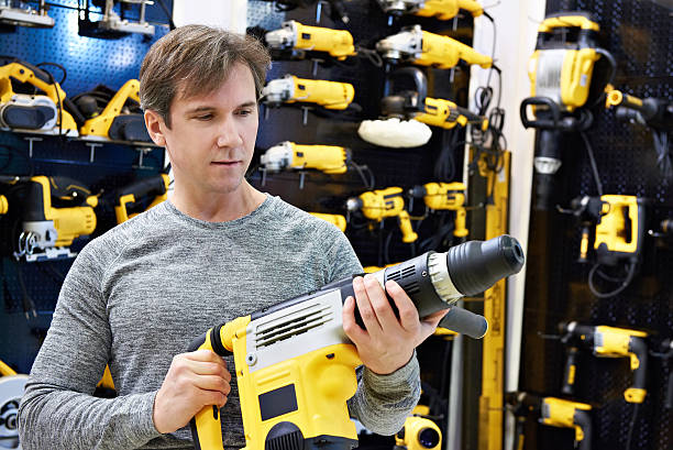 istock Man shopping for hammer drill in hardware store 625601454