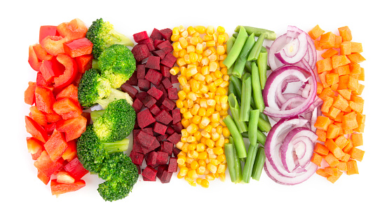 Cut vegetables ready for cooking isolated on white background