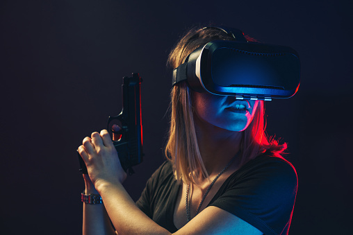 Portrait of a young woman using VR technology.