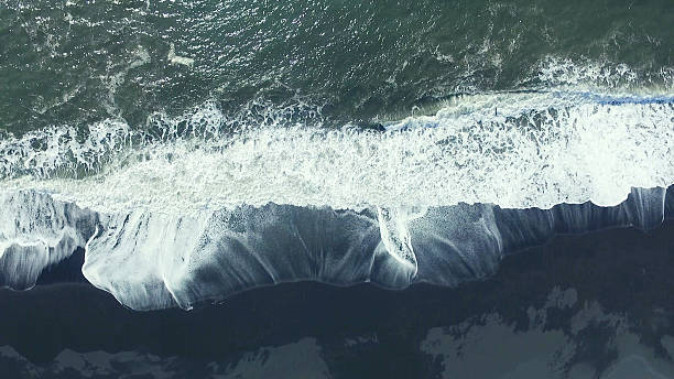 istock black sand beach at iceland 625607138