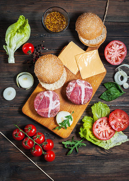 istock Ingredients for making homemade burger on wooden cutting board 625607802