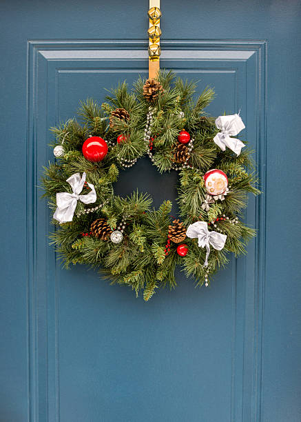 istock Christmas wreath on blue outside door. 625622834