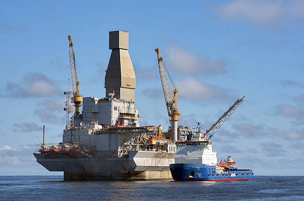 istock Oil rig and support vessel on offshore area 625623066