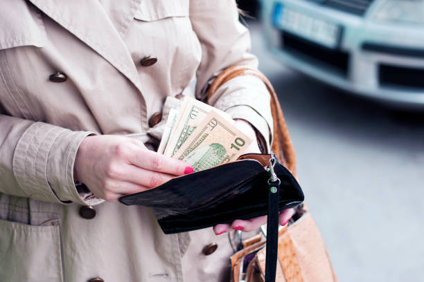 Girl is taking out money from wallet