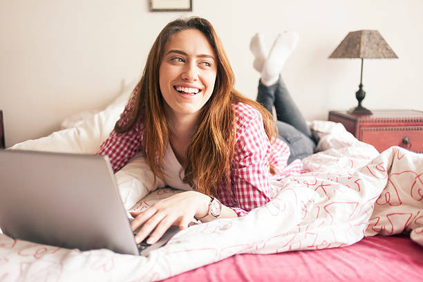 istock Women using laptop at home 625625294