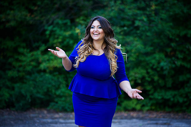 690+ Plus Size Blue Dress Stock Photos, Pictures & Royalty-Free