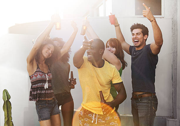 istock Group of friends partying on rooftop 625627296