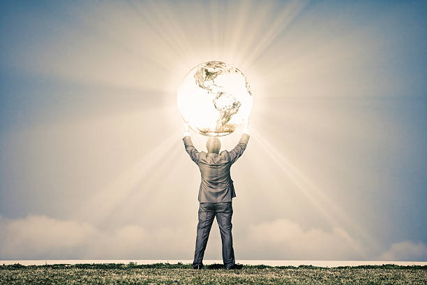 istock Businessman holding world globe 625627436