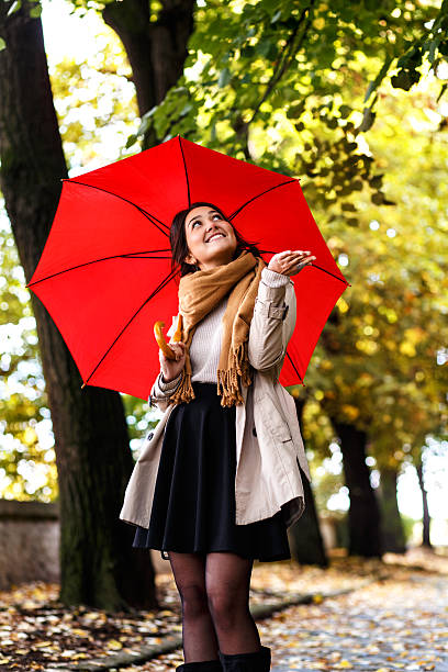 istock Woman with red umbrella 625642416