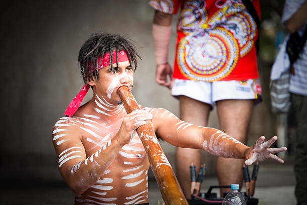 Sydney, Australia - November 20, 2016: Australian aboriginal male playing didgeridoo, street performer at Circular Quay Sydney Australia