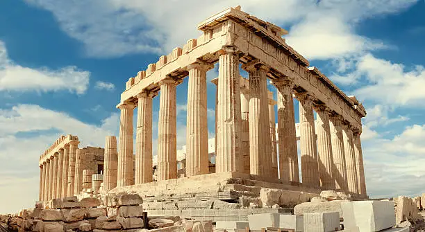Parthenon temple on a bright day. Acropolis in Athens, Greece. Horizontal panorama, this image is toned.