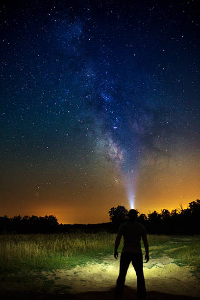 istock Explorer with looking at the stars 625650392