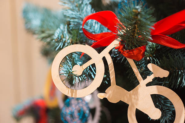 istock Wooden Christmas toy a bicycle on   tree 625651202