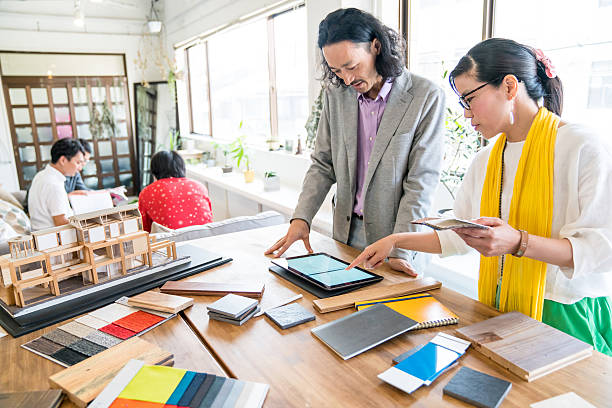 istock Interior designers working in an architectural firm 625651280