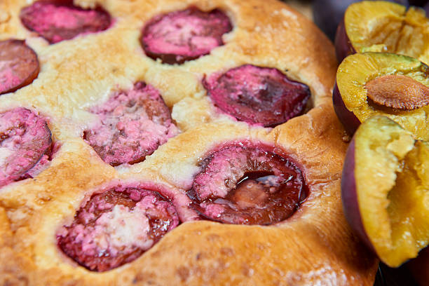 istock Home made plum buns on a wooden table 625652204