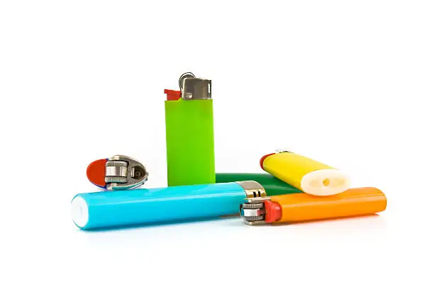 Photo of Colored lighters isolated on white background