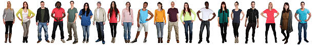 Large group of young people smiling happy multicultural multi ethnic full body portrait standing in a row isolated on a white background