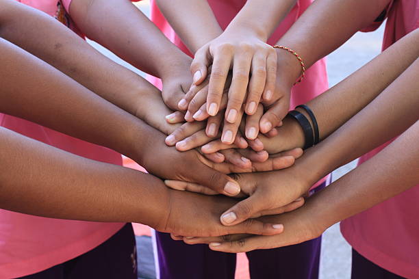 istock female holding hand together with , strong concept  teamwork friendship 625659588