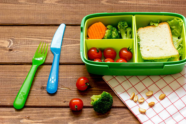 istock lunch box for kid with fresh vegetables on wooden background 625659864