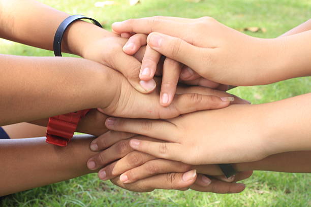 istock female holding hand together with , strong concept  teamwork friendship 625660226