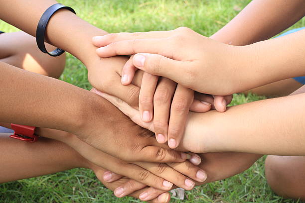 istock female holding hand together with , strong concept  teamwork friendship 625660266