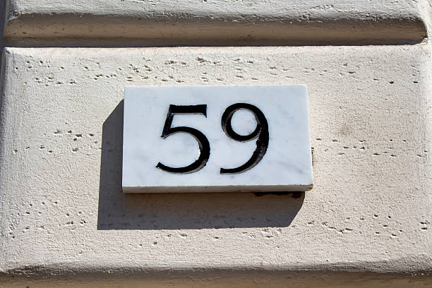istock Engraved building number of 59 in Rome. 625663228