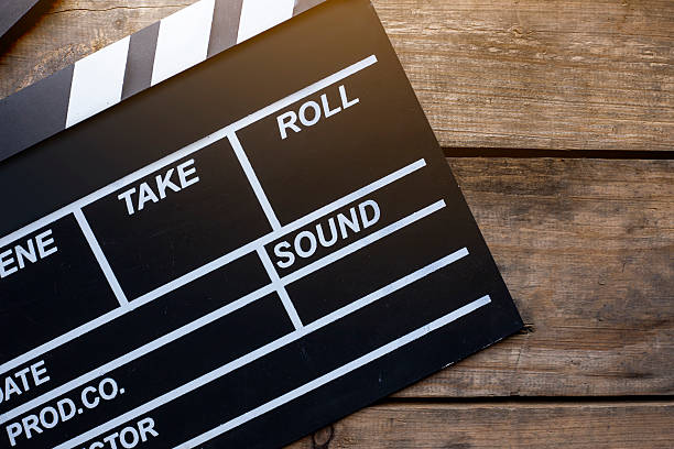 istock movie clapper on wood table 625668670