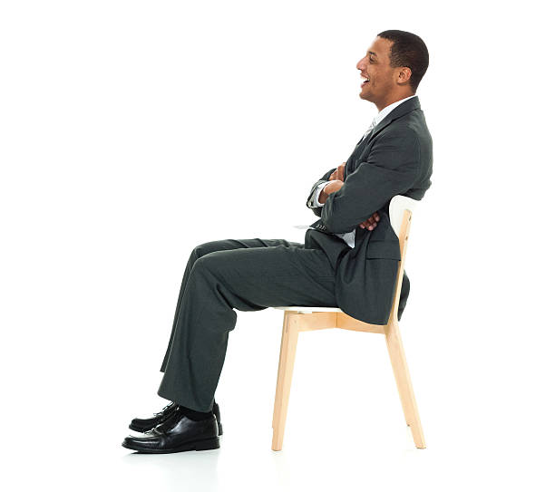 istock Smiling businessman sitting on chair 625670342