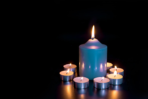 Candle Against Dark Background