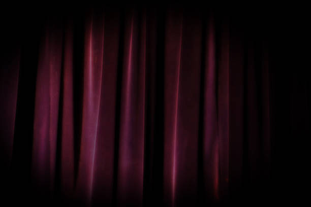 istock old grunge theater purple curtain background. dramatic background 625670766
