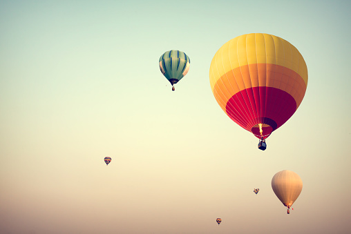 Hot air balloon on sky with fog, vintage and retro filter effect style