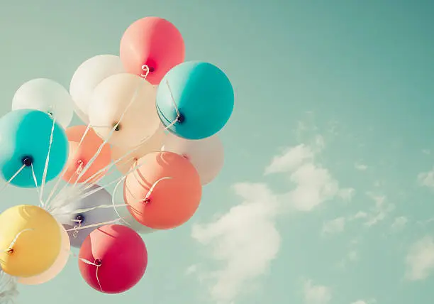 colorful balloons. happy birthday party in summer holidays - vintage pastel color styles.