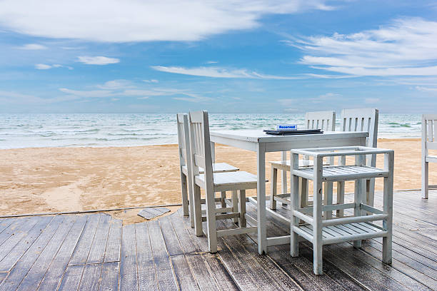 istock wood floor and seaside table with beach and sea background 625672334