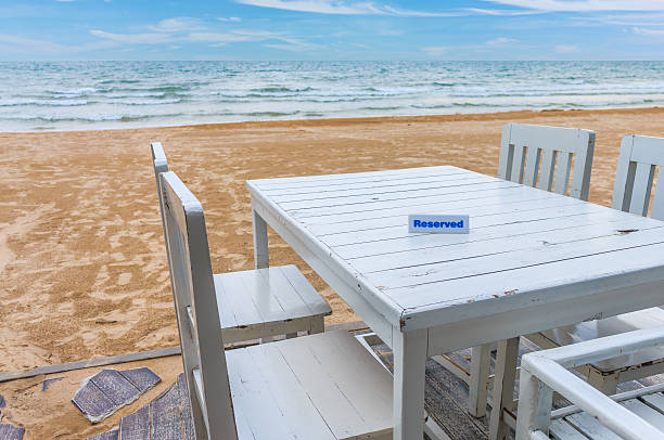 istock seaside table with beach and sea background 625672370