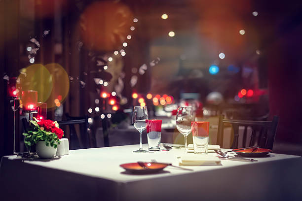 Holiday Setting Romantic dinner setup or Holiday table setting, red decoration with candle light. soulmates stock pictures, royalty-free photos & images