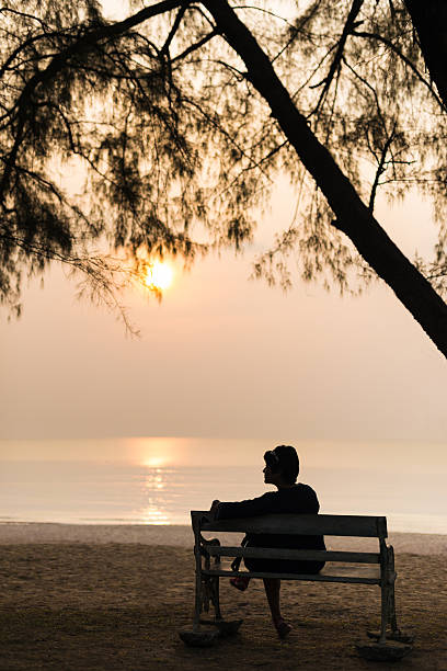 istock Lady at Sunset on the Beach 625673610