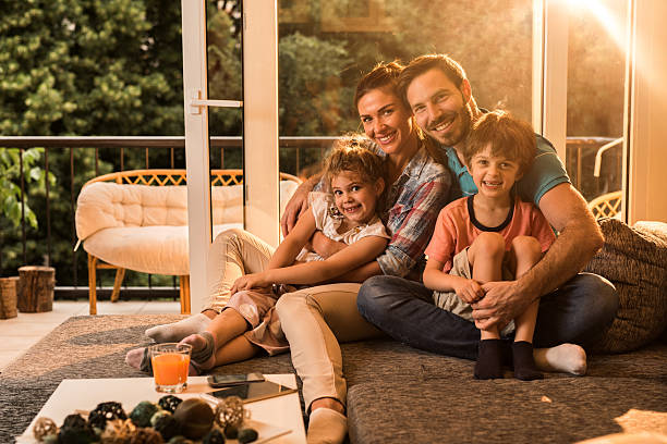 istock Young happy family relaxing on sofa at home. 625683034
