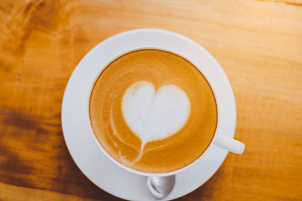 istock hot milk art coffee on wooden table 625683378
