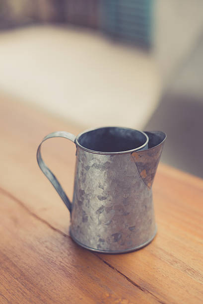 istock stainless pitcher for make coffee on wood background 625683518