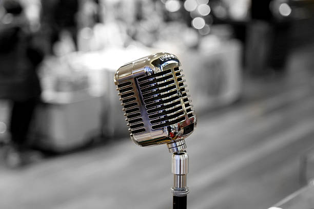 istock close up of microphone in the hall 625683718