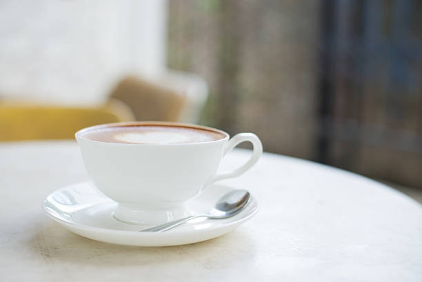 istock Laptop and coffee cup on wooden table 625684028