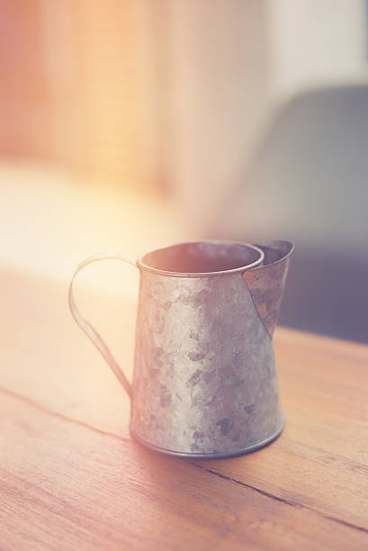 istock stainless pitcher for make coffee on wood background 625684632