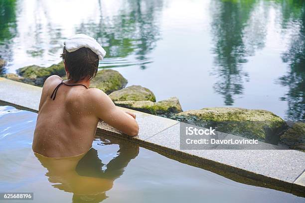 Young Man Enjoying Hot Spring Water On Hokkaido Japan Stock Photo - Download Image Now