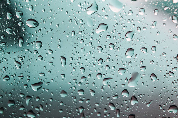 istock natural water drop on glass,water drops background 625688360