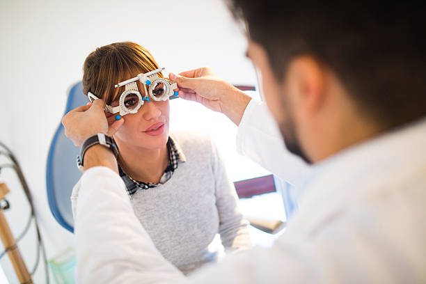 istock Young woman having her eyes examined by optometrist. 625690484