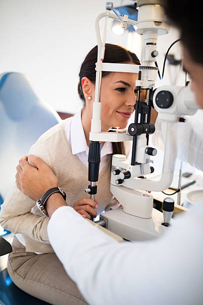 istock Young woman having her eyes examined by optometrist. 625690746