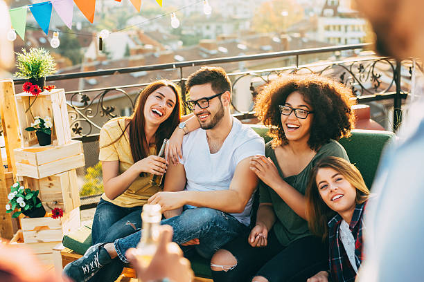 Roof party A group of friends having fun a party on the roof. group of people wearing eyeglasses stock pictures, royalty-free photos & images