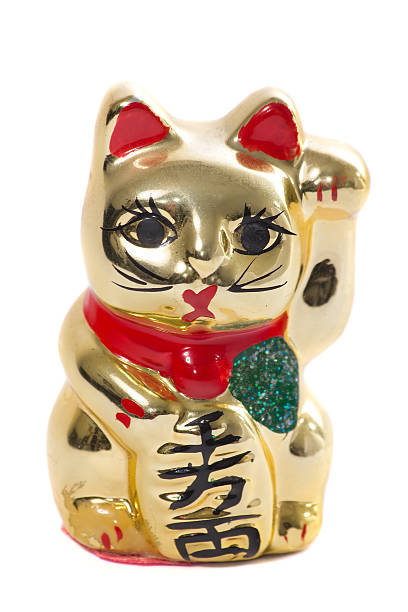istock Golden japanese cat ceramic on white background 625702728