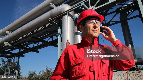 Industrial Worker With Cell Phone Stock Photo - Download Image Now - Using Phone, Construction Worker, Manufacturing Occupation