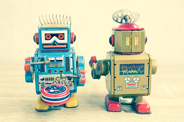 istock Old robot toy on wood table. 625705134